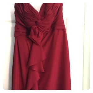 Strapless red dress with ruching detail.